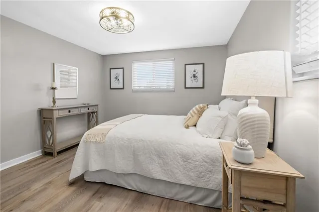 a bedroom with a bed and a lamp on table