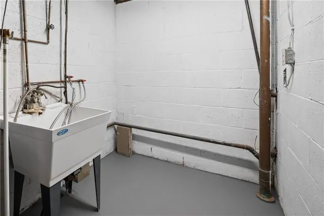 a bathroom with a sink and mirror