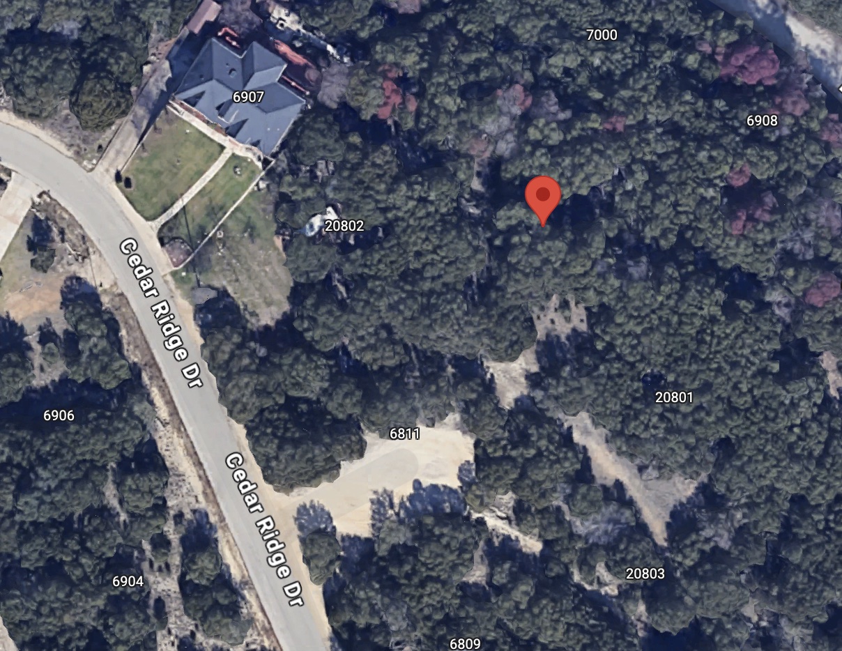 a aerial view of a house with a backyard