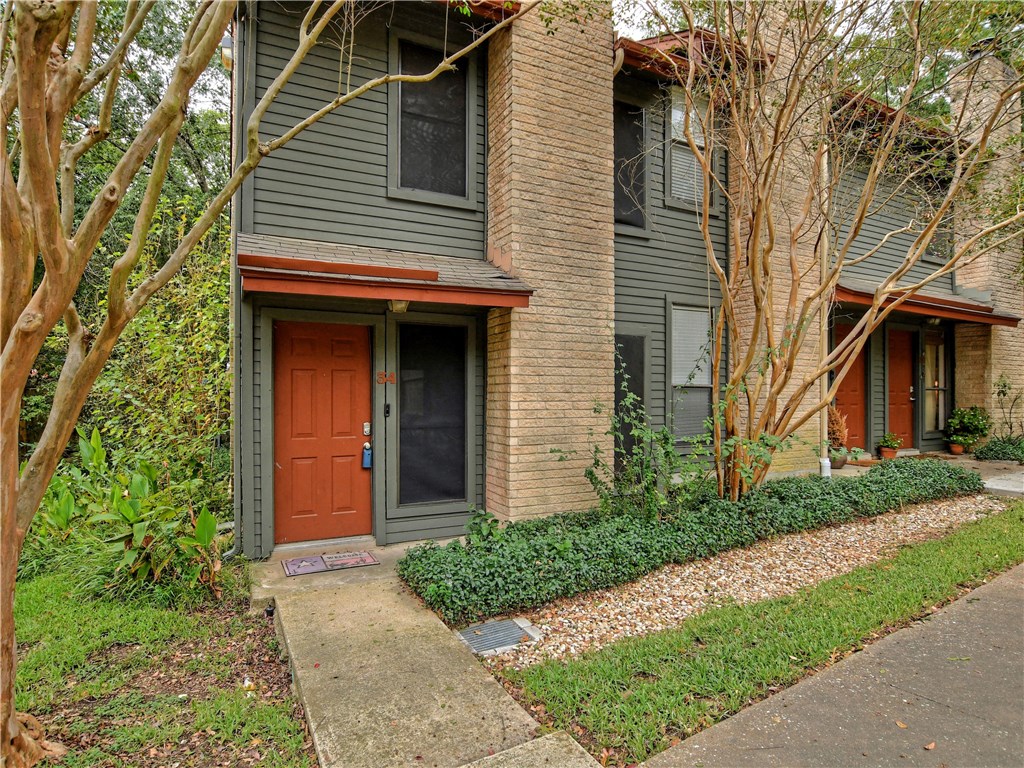3815 Manchaca Road, Unit 34 Austin, TX 78704 - Photo 1 of 1 a view of a house with a yard