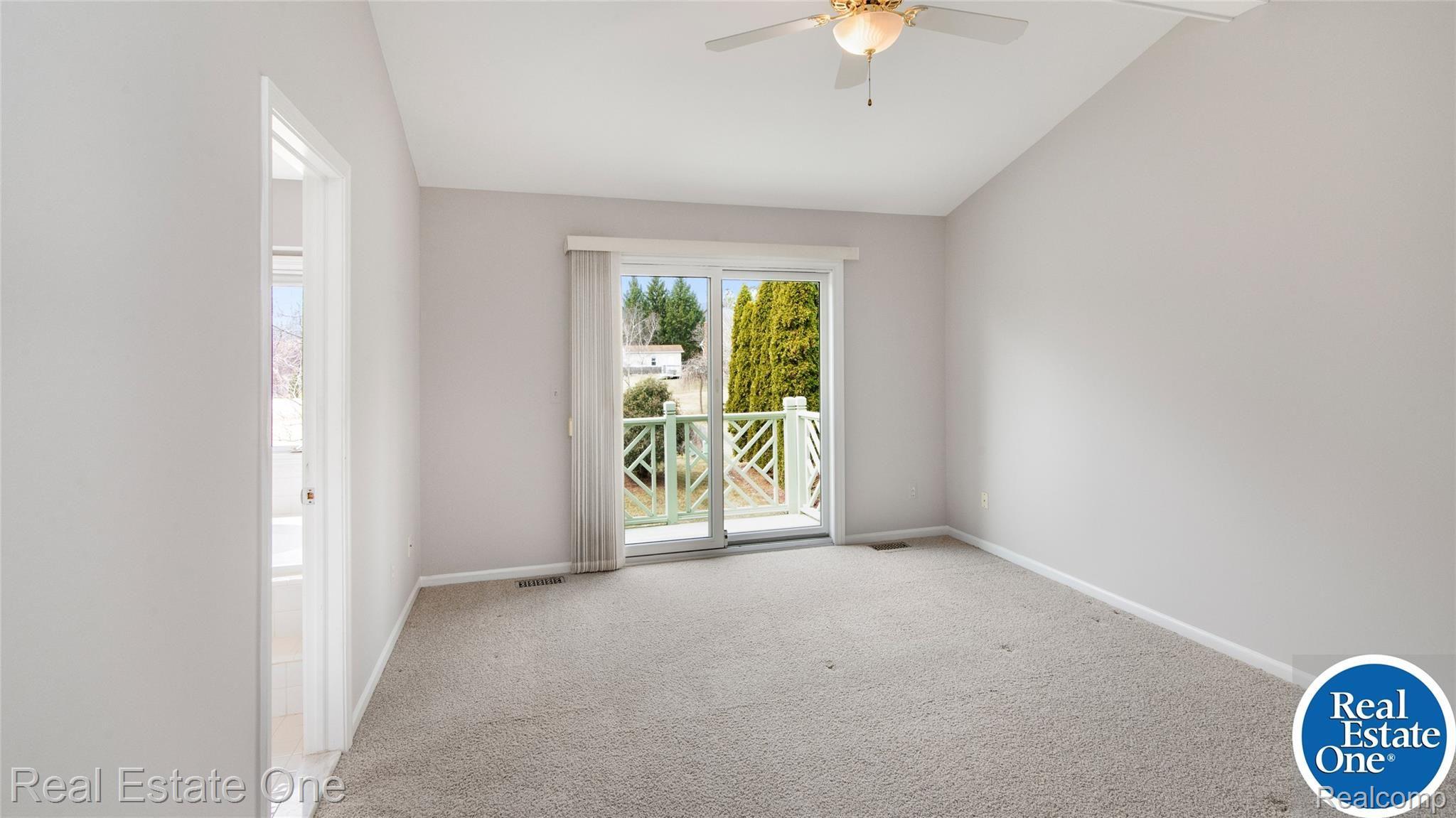 19449 Newburgh Road Livonia, MI 48152 - Photo 22 of 41 Primary bedroom includes private deck & en-suite bathroom.