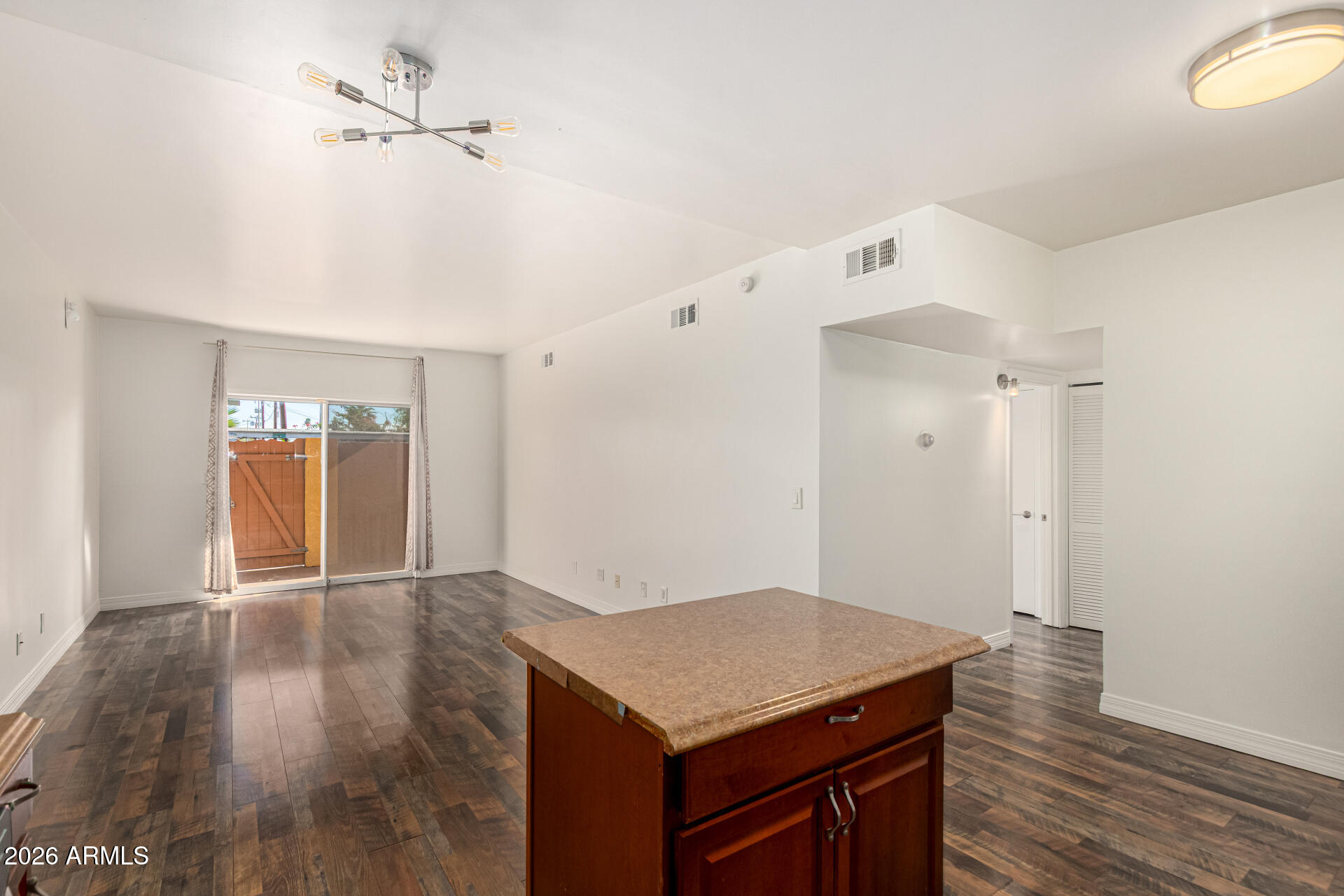 357 East Thomas Road, Unit A111 Phoenix, AZ 85012 - Photo 13 of 41 a view of a kitchen with wooden floor and window