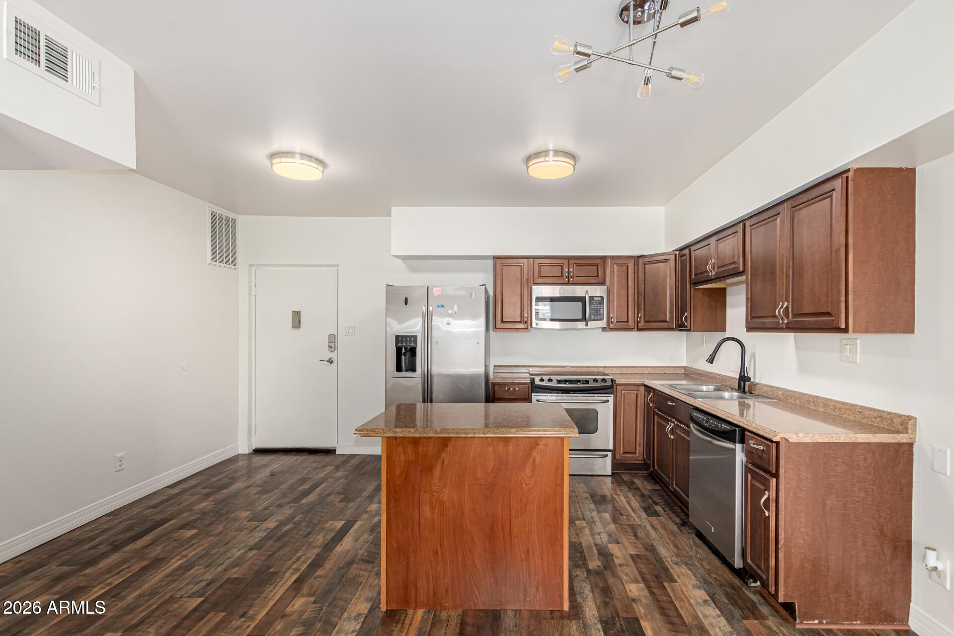 357 East Thomas Road, Unit A111 Phoenix, AZ 85012 - Photo 14 of 41 a kitchen with stainless steel appliances granite countertop a sink stove and refrigerator