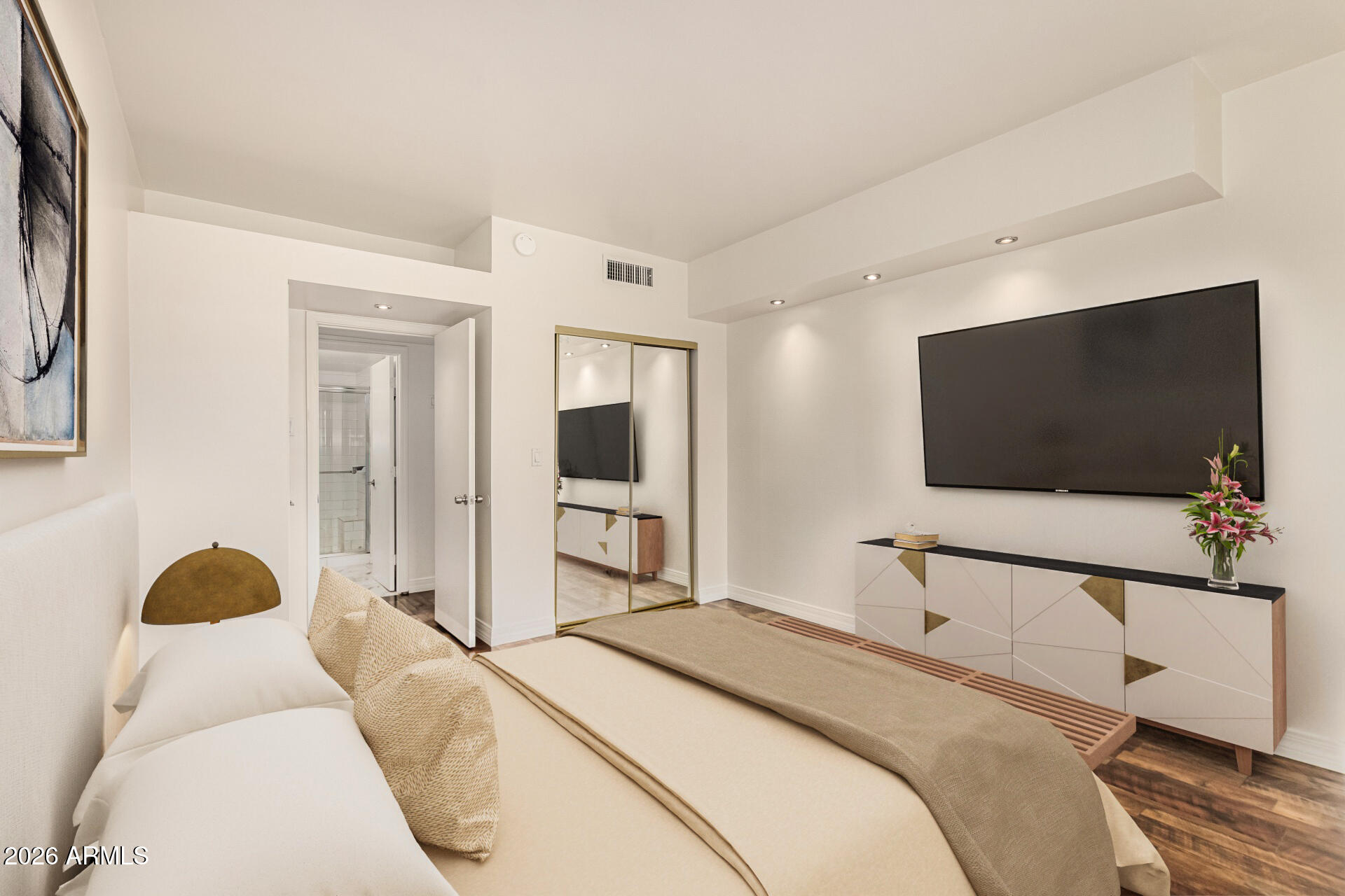 357 East Thomas Road, Unit A111 Phoenix, AZ 85012 - Photo 22 of 41 a bedroom with a bed and a flat screen tv