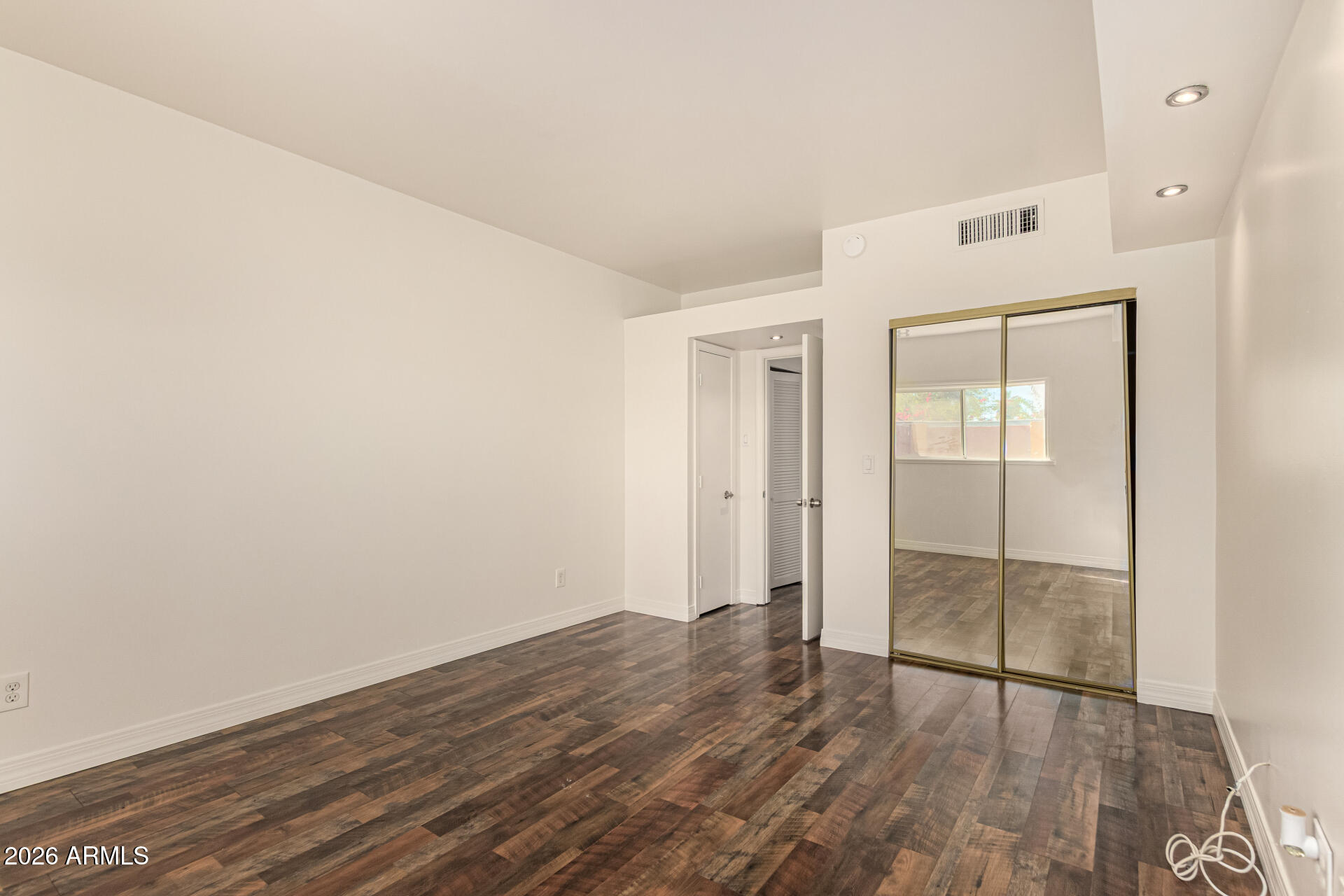 357 East Thomas Road, Unit A111 Phoenix, AZ 85012 - Photo 25 of 41 wooden floor in an empty room