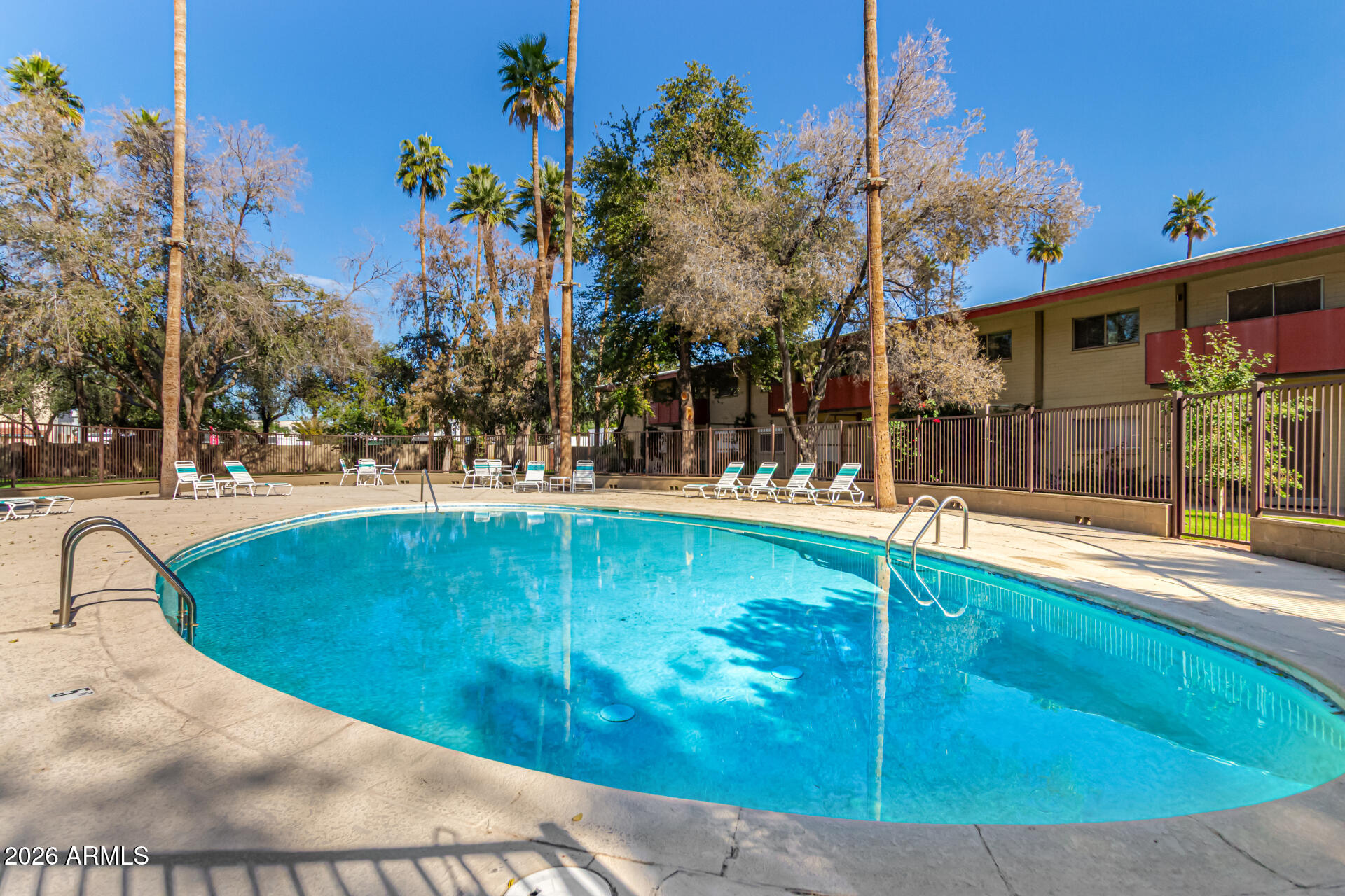 357 East Thomas Road, Unit A111 Phoenix, AZ 85012 - Photo 37 of 41 a swimming pool with outdoor seating and yard
