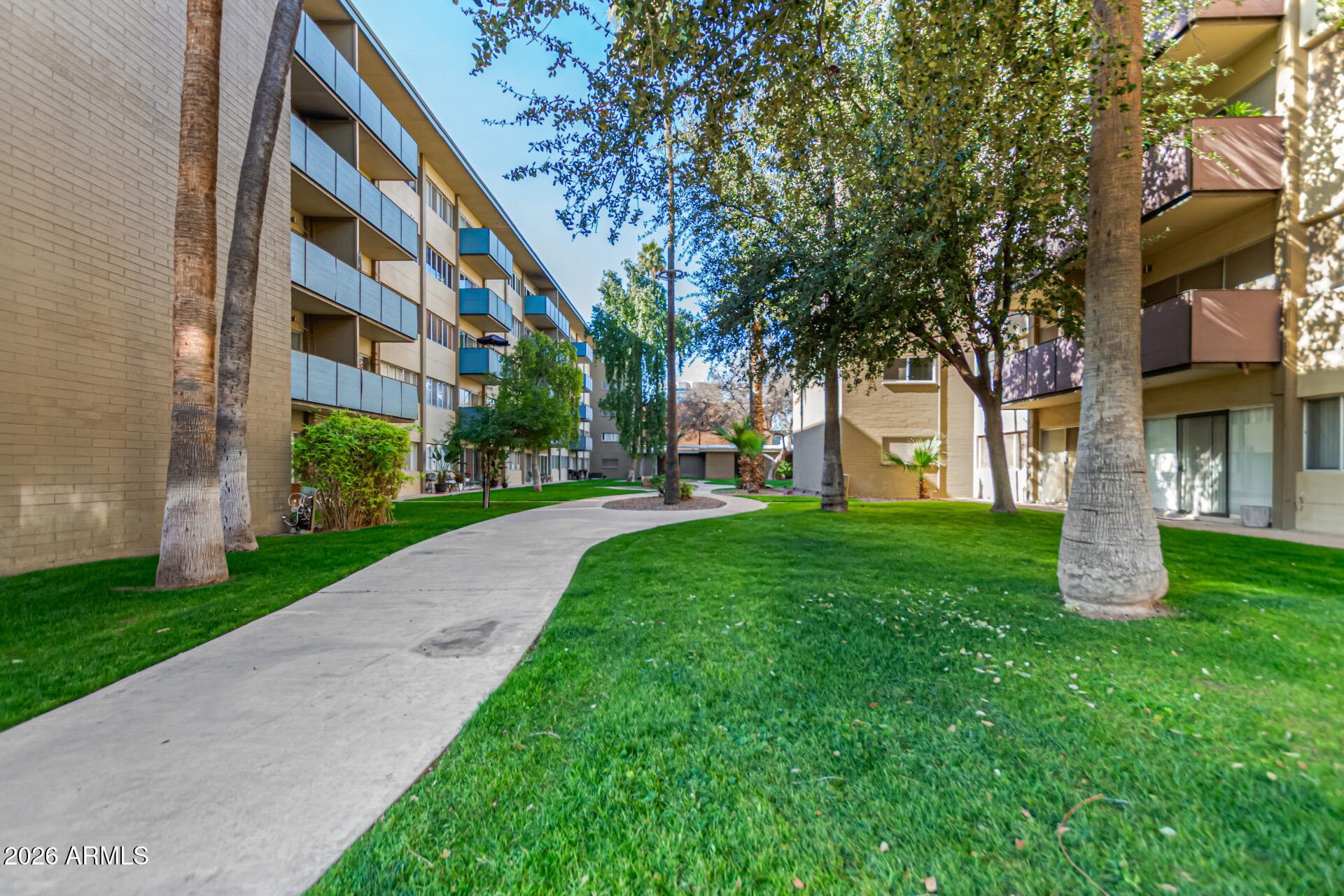 357 East Thomas Road, Unit A111 Phoenix, AZ 85012 - Photo 39 of 41 a view of a building with a yard