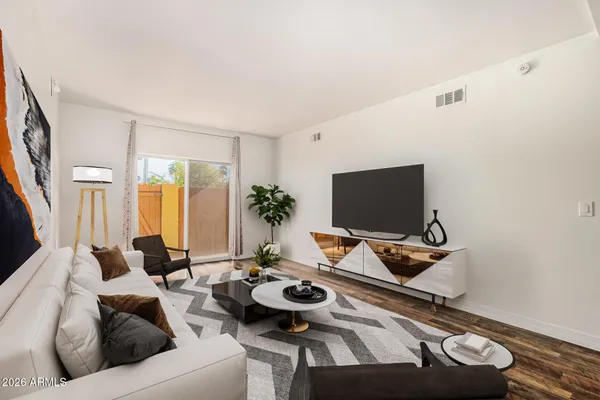 a living room with furniture and a flat screen tv