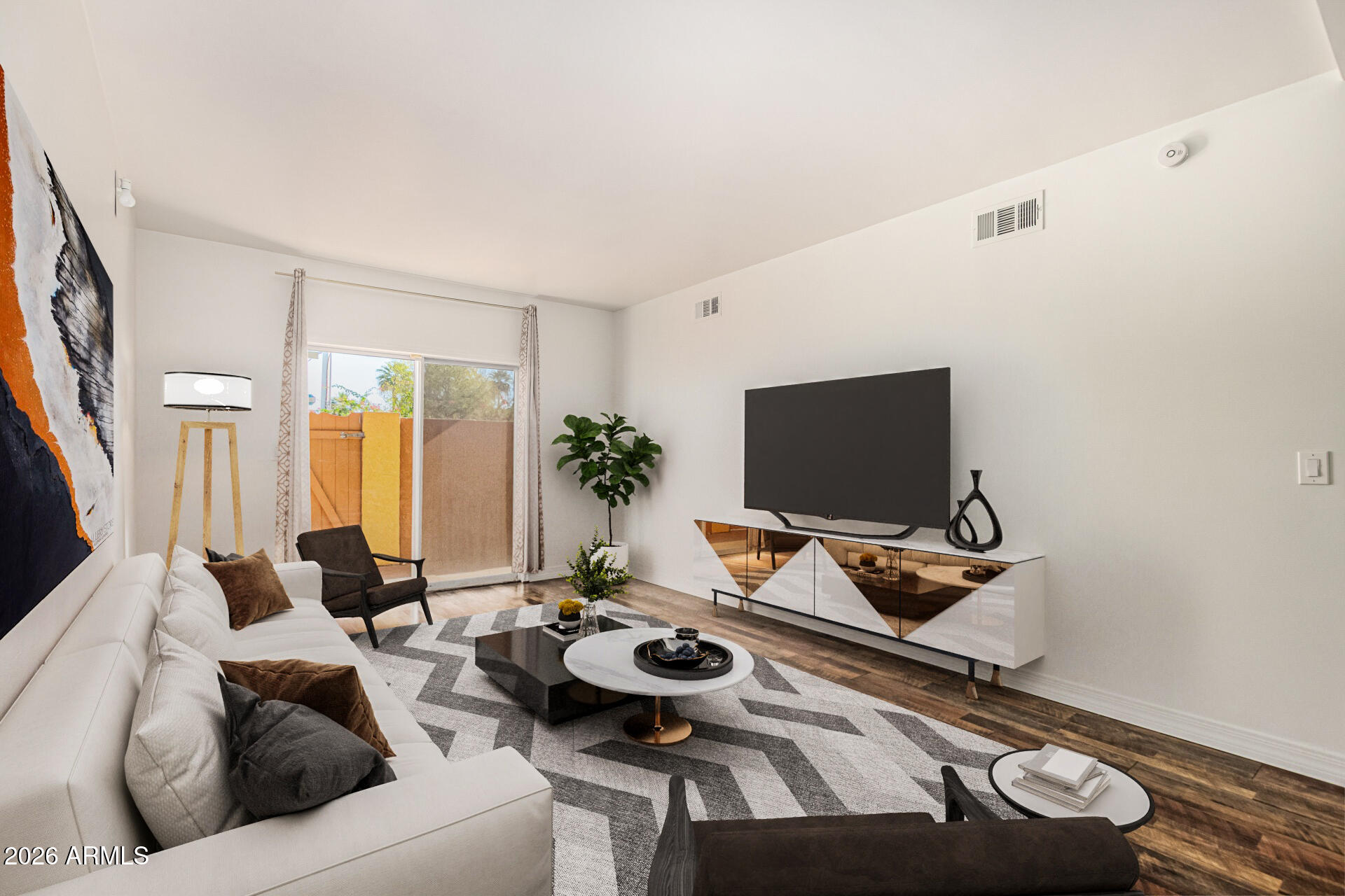 357 East Thomas Road, Unit A111 Phoenix, AZ 85012 - Photo 6 of 41 a living room with furniture and a flat screen tv