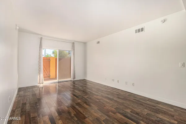 a view of kitchen with furniture and wooden floor