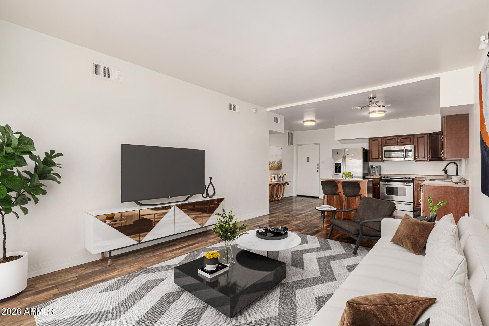 357 East Thomas Road, Unit A111 Phoenix, AZ 85012 - Photo 8 of 41 a living room with furniture and a flat screen tv