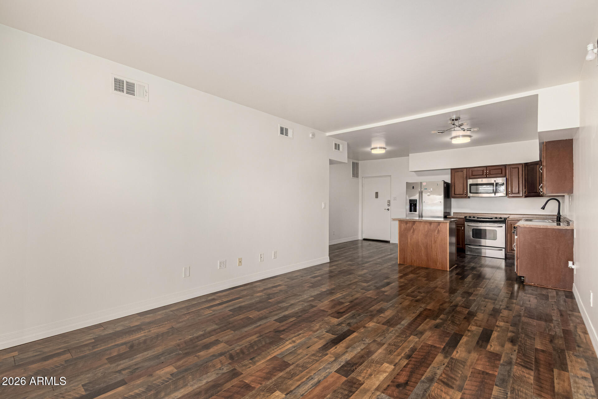 357 East Thomas Road, Unit A111 Phoenix, AZ 85012 - Photo 9 of 41 a view of kitchen with furniture and wooden floor