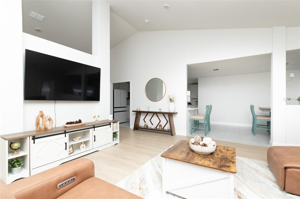 11267 Northwest 4th Street Ocala, FL 34482 - Photo 12 of 86 a living room with furniture and flat screen tv