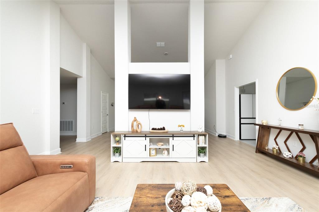 11267 Northwest 4th Street Ocala, FL 34482 - Photo 14 of 86 a living room with furniture and a flat screen tv