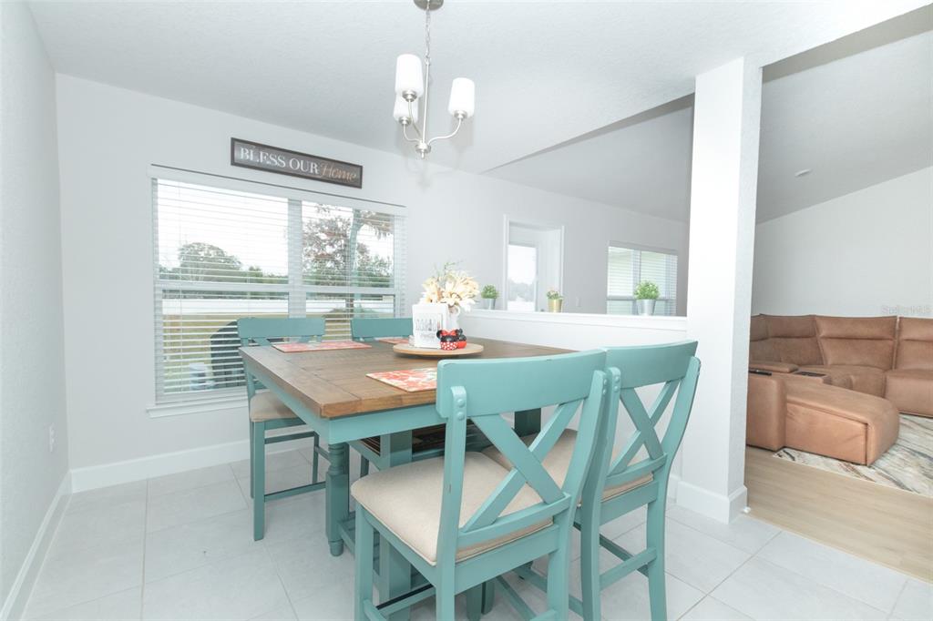 11267 Northwest 4th Street Ocala, FL 34482 - Photo 16 of 86 a view of a dining room with furniture window and outside view