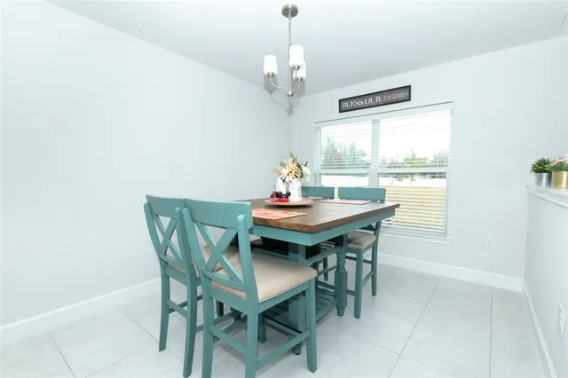 a kitchen with white cabinets and a sink