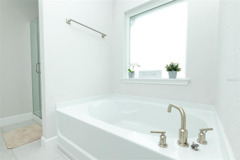 11267 Northwest 4th Street Ocala, FL 34482 - Photo 33 of 86 a white bath tub sitting next to a window