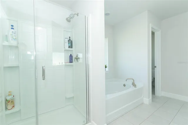 a bed room with a bed and a television