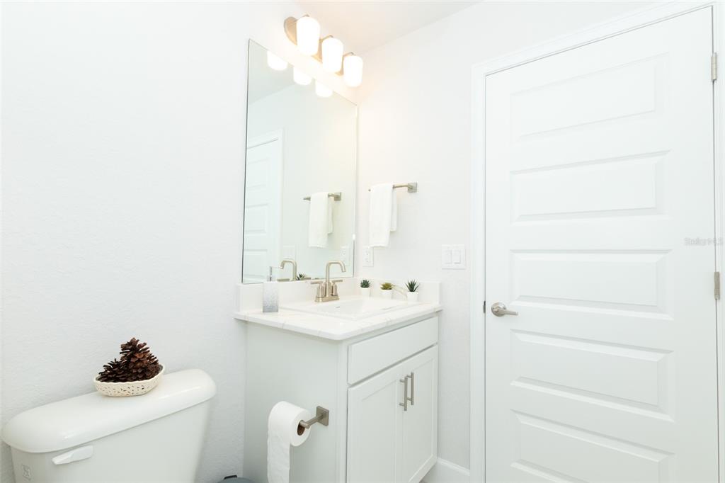 11267 Northwest 4th Street Ocala, FL 34482 - Photo 50 of 86 a bathroom with a sink vanity and a toilet