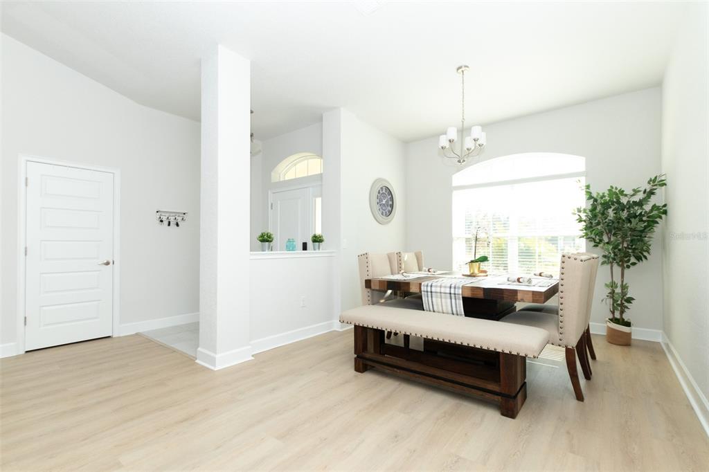 11267 Northwest 4th Street Ocala, FL 34482 - Photo 5 of 86 a spacious bedroom with a bed a couch and a potted plant