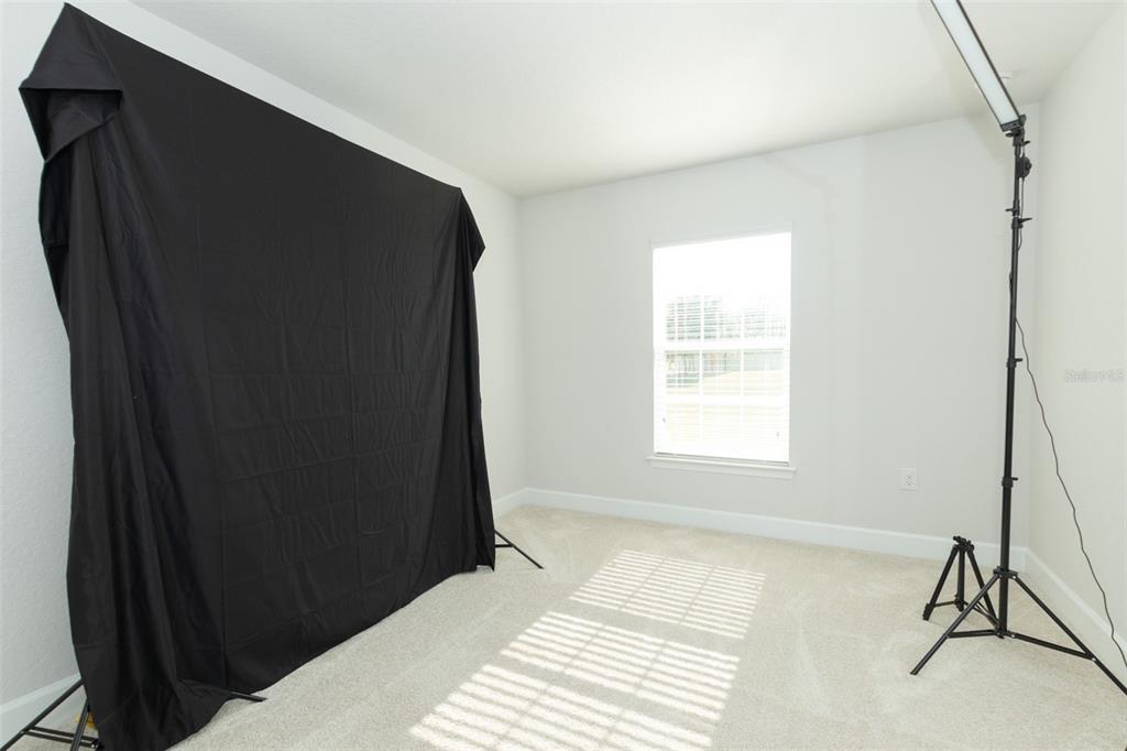 11267 Northwest 4th Street Ocala, FL 34482 - Photo 53 of 86 a view of a bedroom with wooden floor and a window