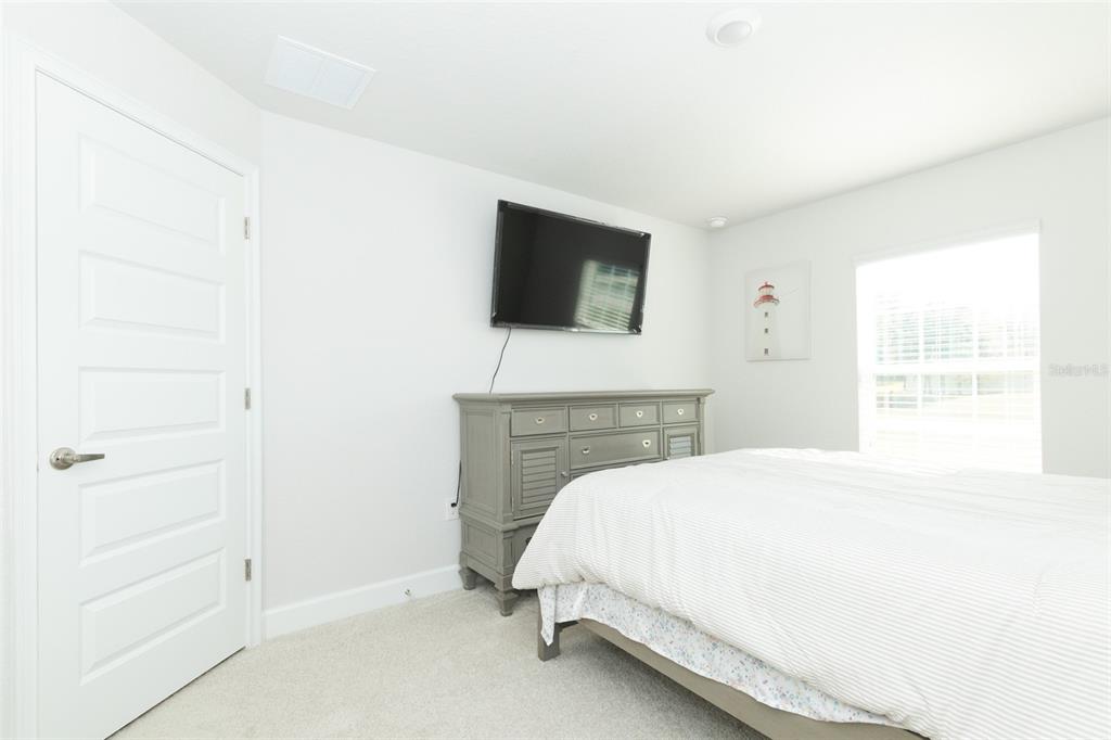 11267 Northwest 4th Street Ocala, FL 34482 - Photo 57 of 86 a bed room with a bed and a television