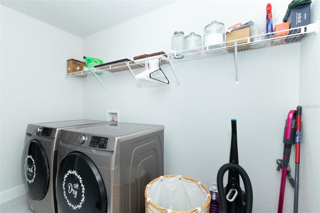 11267 Northwest 4th Street Ocala, FL 34482 - Photo 61 of 86 a view of a storage and utility room with racks on the wall