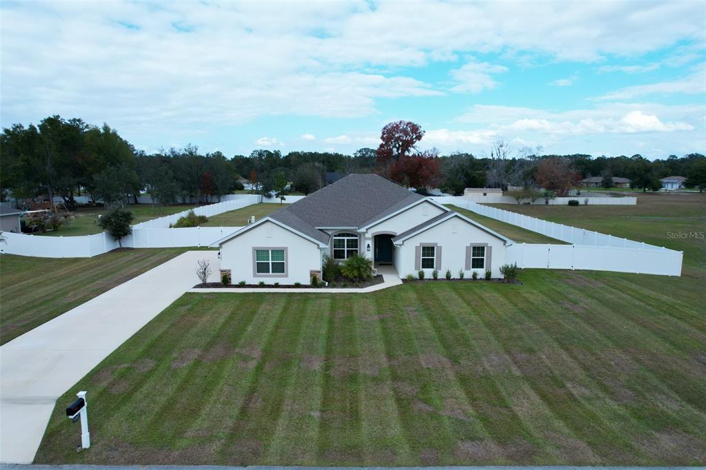 11267 Northwest 4th Street Ocala, FL 34482 - Photo 74 of 86 a front view of a house with a yard