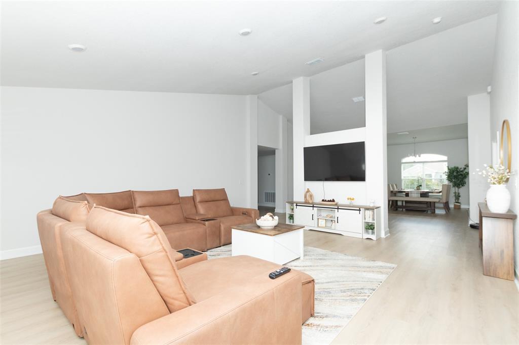 11267 Northwest 4th Street Ocala, FL 34482 - Photo 8 of 86 a living room with furniture and a flat screen tv