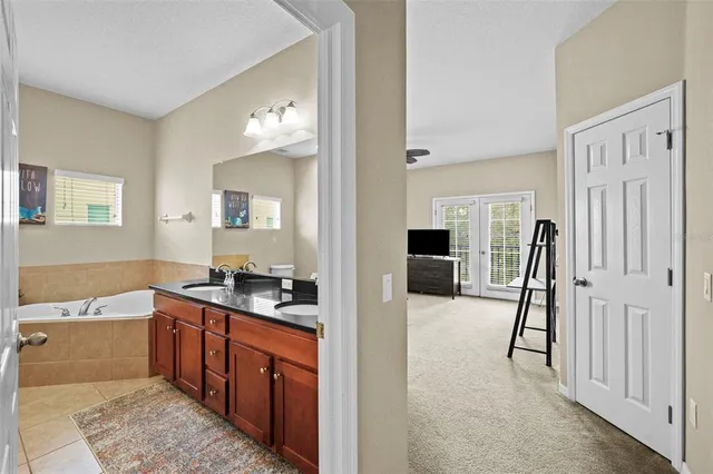 a large bathroom with a sink and a mirror