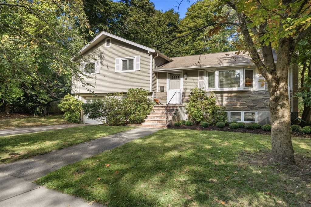 174 Middlesex Road Chestnut Hill, MA 02467 - Photo 1 of 18 front view of a house with a yard