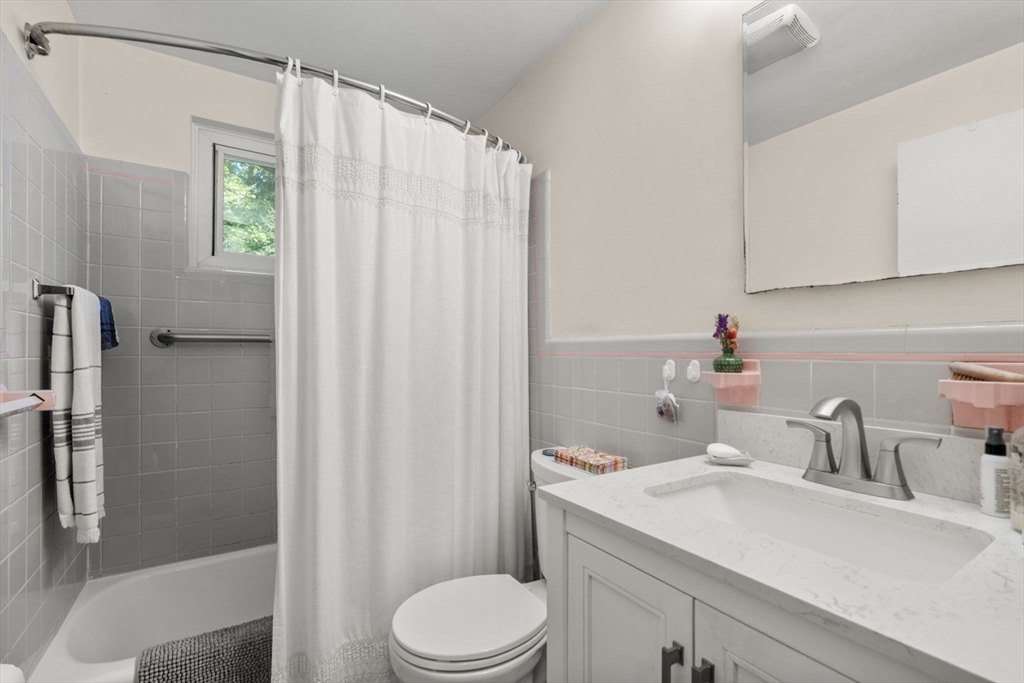 174 Middlesex Road Chestnut Hill, MA 02467 - Photo 11 of 18 a bathroom with a sink a toilet and shower