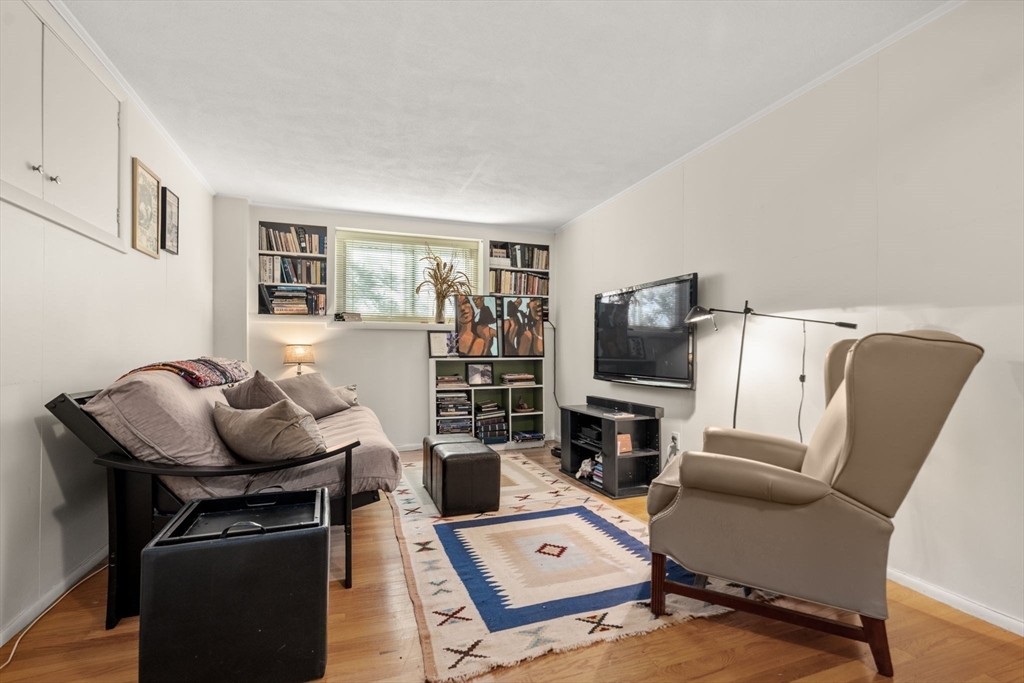 174 Middlesex Road Chestnut Hill, MA 02467 - Photo 12 of 18 a living room with furniture and a flat screen tv