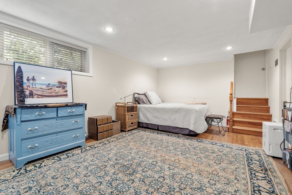 174 Middlesex Road Chestnut Hill, MA 02467 - Photo 14 of 18 a bedroom with a bed and wooden floor