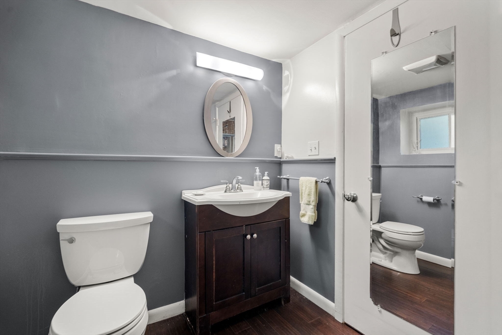 174 Middlesex Road Chestnut Hill, MA 02467 - Photo 15 of 18 a bathroom with a toilet sink and mirror