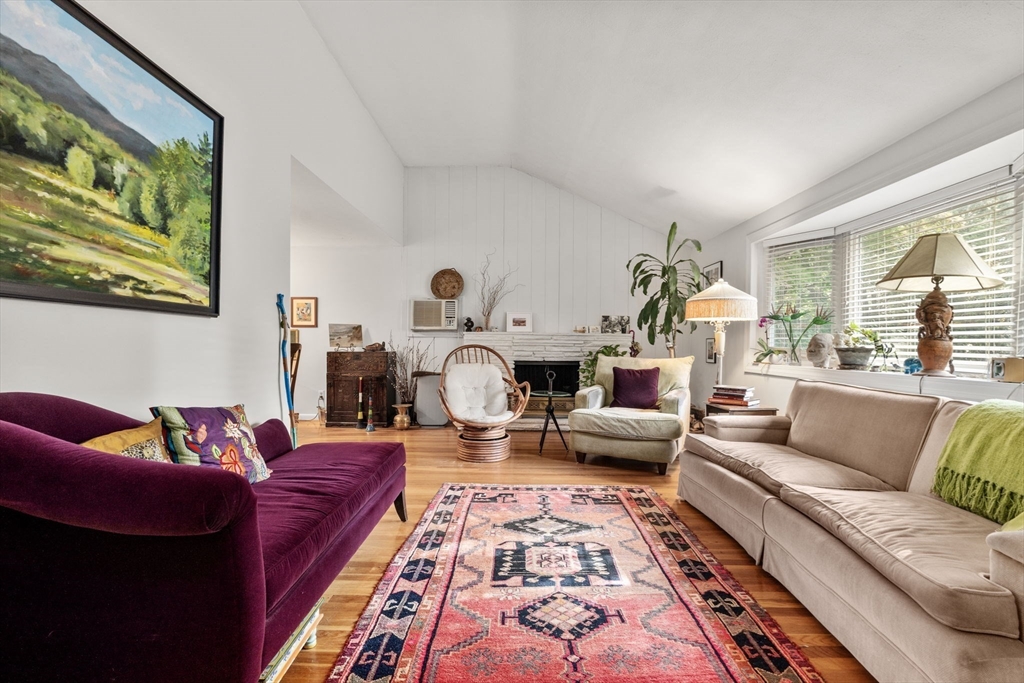 174 Middlesex Road Chestnut Hill, MA 02467 - Photo 3 of 18 a living room with furniture and a fireplace