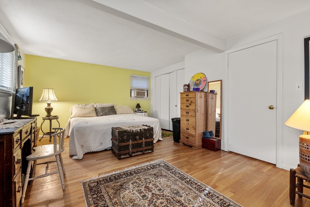 174 Middlesex Road Chestnut Hill, MA 02467 - Photo 8 of 18 a bedroom with a bed and a walk in closet