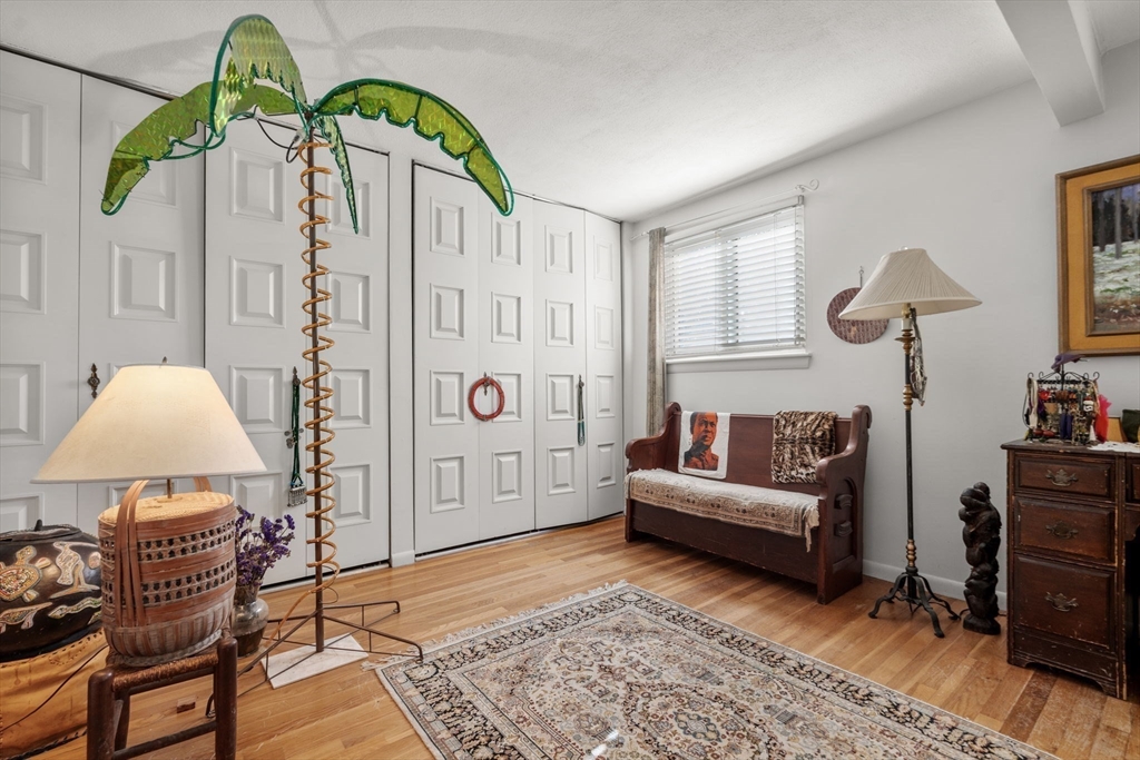 174 Middlesex Road Chestnut Hill, MA 02467 - Photo 9 of 18 a living room with furniture and wooden floor