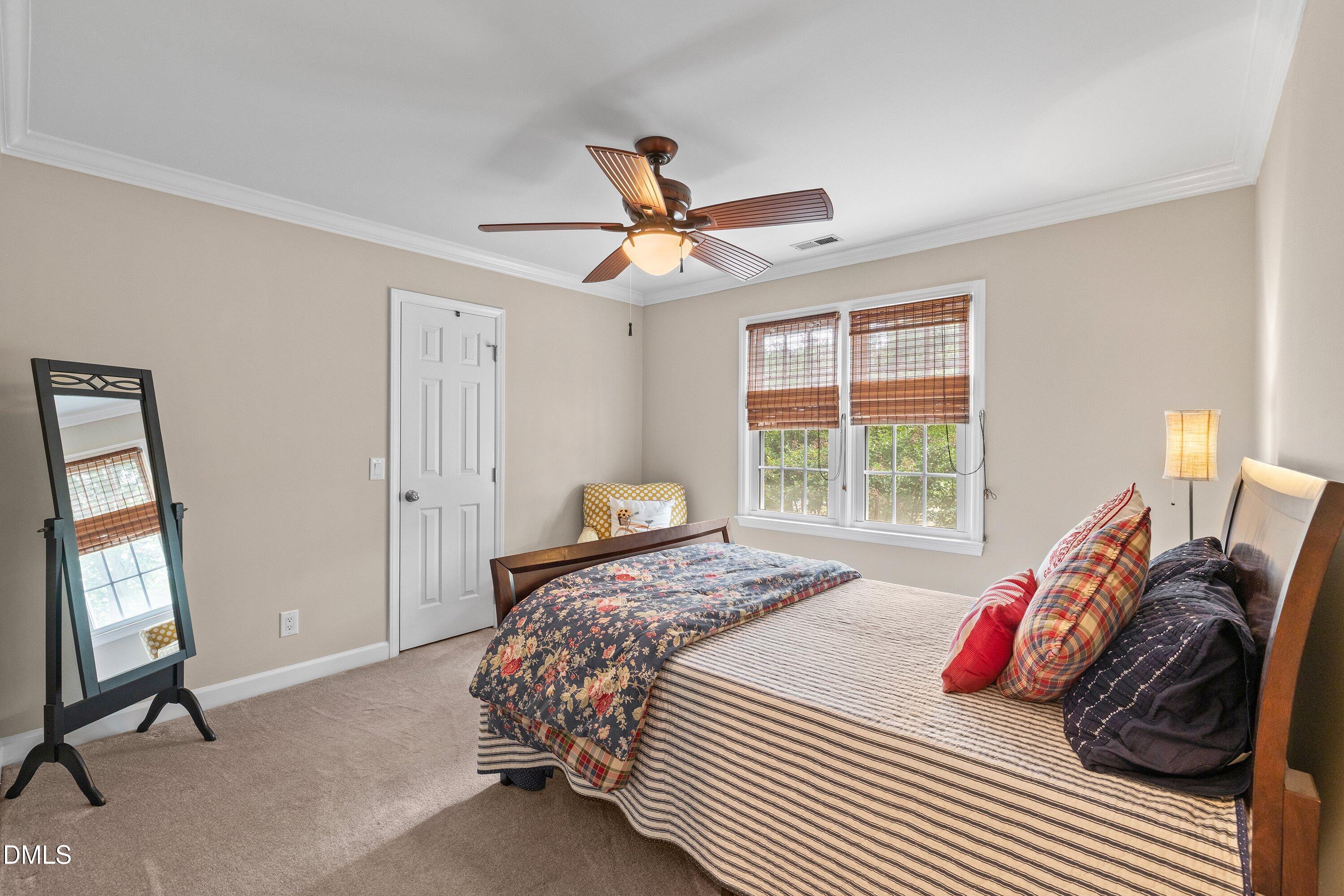 6612 Fowler Road Zebulon, NC 27597 - Photo 27 of 42 a bedroom with a bed and a window