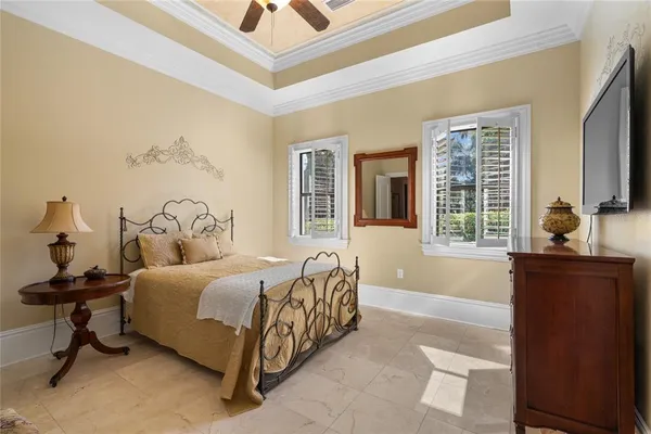 a living room with furniture and a painting on the wall