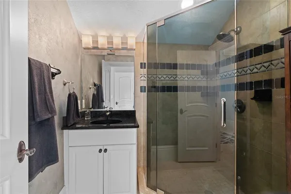 a bed room with a bed and a television