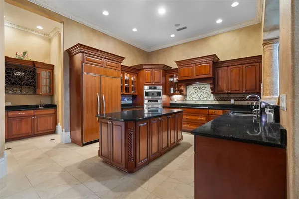 a bathroom with a sink and a large mirror