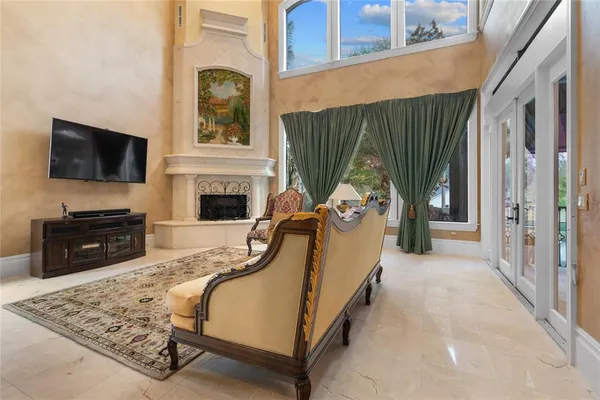 a living room with furniture ceiling fan and a rug