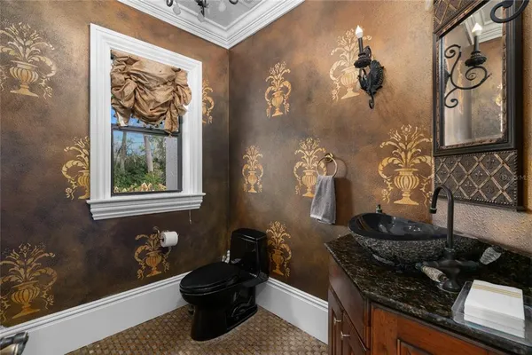 a bathroom with a sink a toilet and a mirror