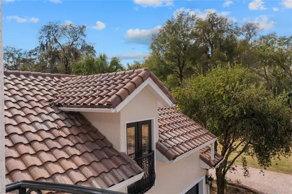 an aerial view of a house with outdoor space