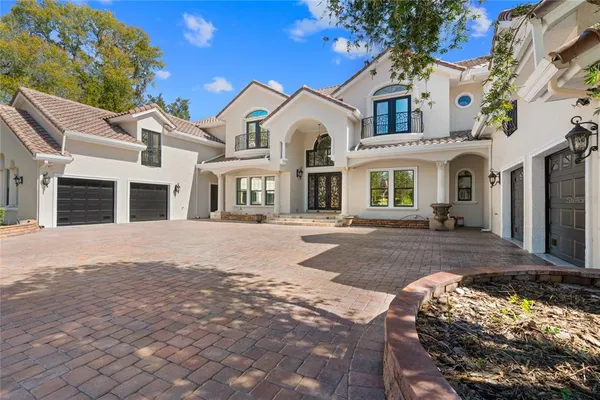 a living room with fireplace furniture and a flat screen tv