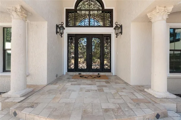 a bathroom with a toilet sink and a mirror