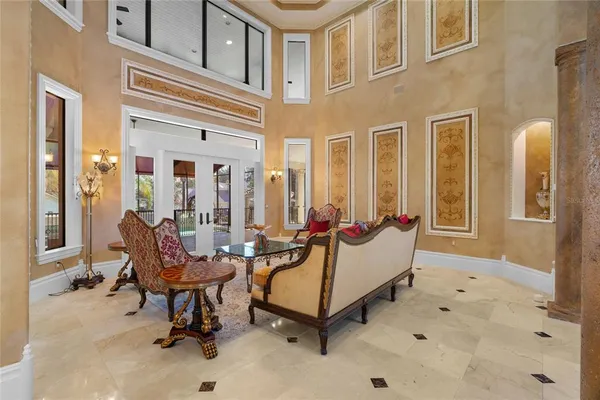 a view of a livingroom with an entryway and a fireplace