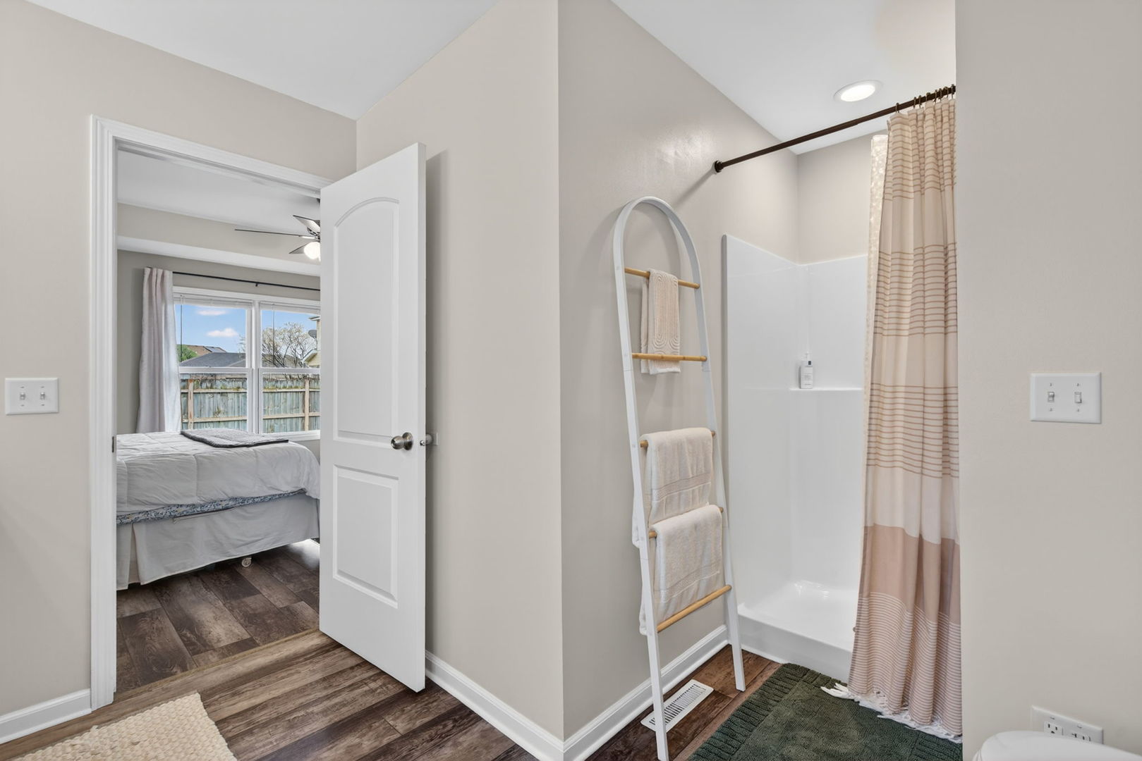 2031 Locust Road Morris, IL 60450 - Photo 17 of 32 a bathroom with a glass shower door and a window