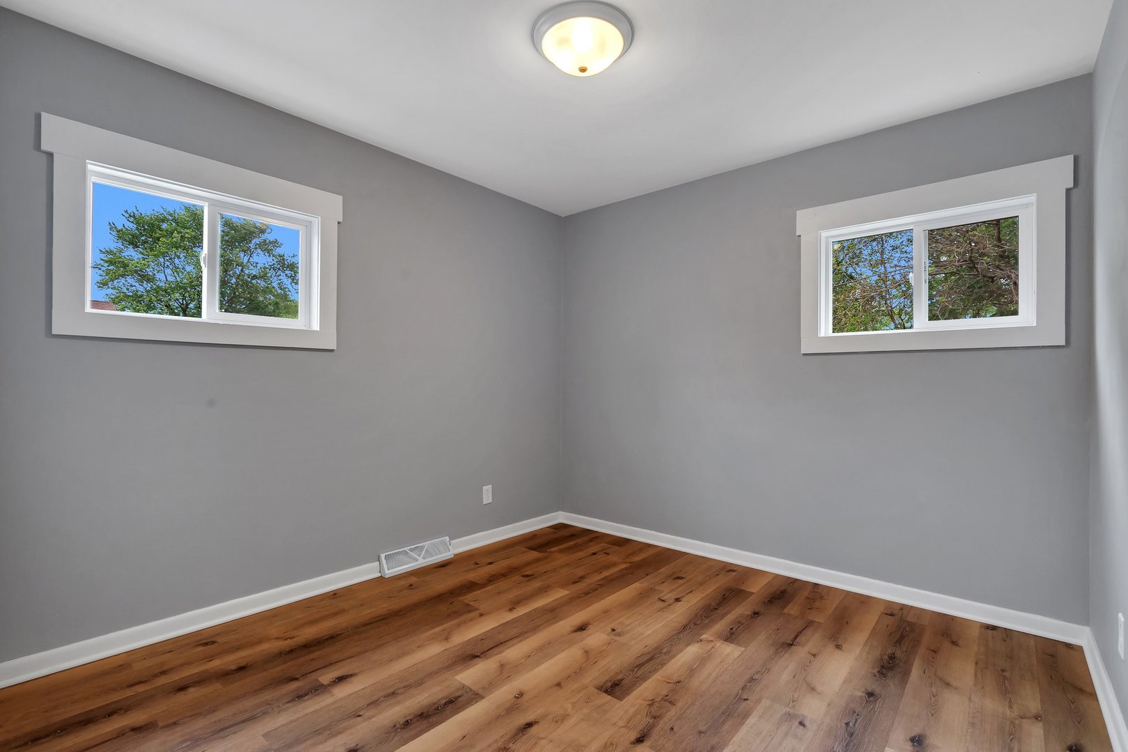 1314 West Washington Street Ottawa, IL 61350 - Photo 15 of 21 a view of an empty room with wooden floor and a window